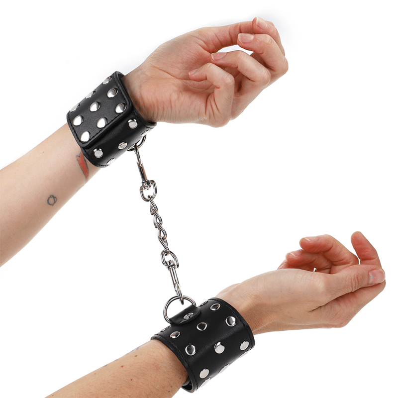Appareils de retenue poignets avec fermeture pression pleine de rivets noir ajustable 19-24 CM X 5,5 CM — KINK